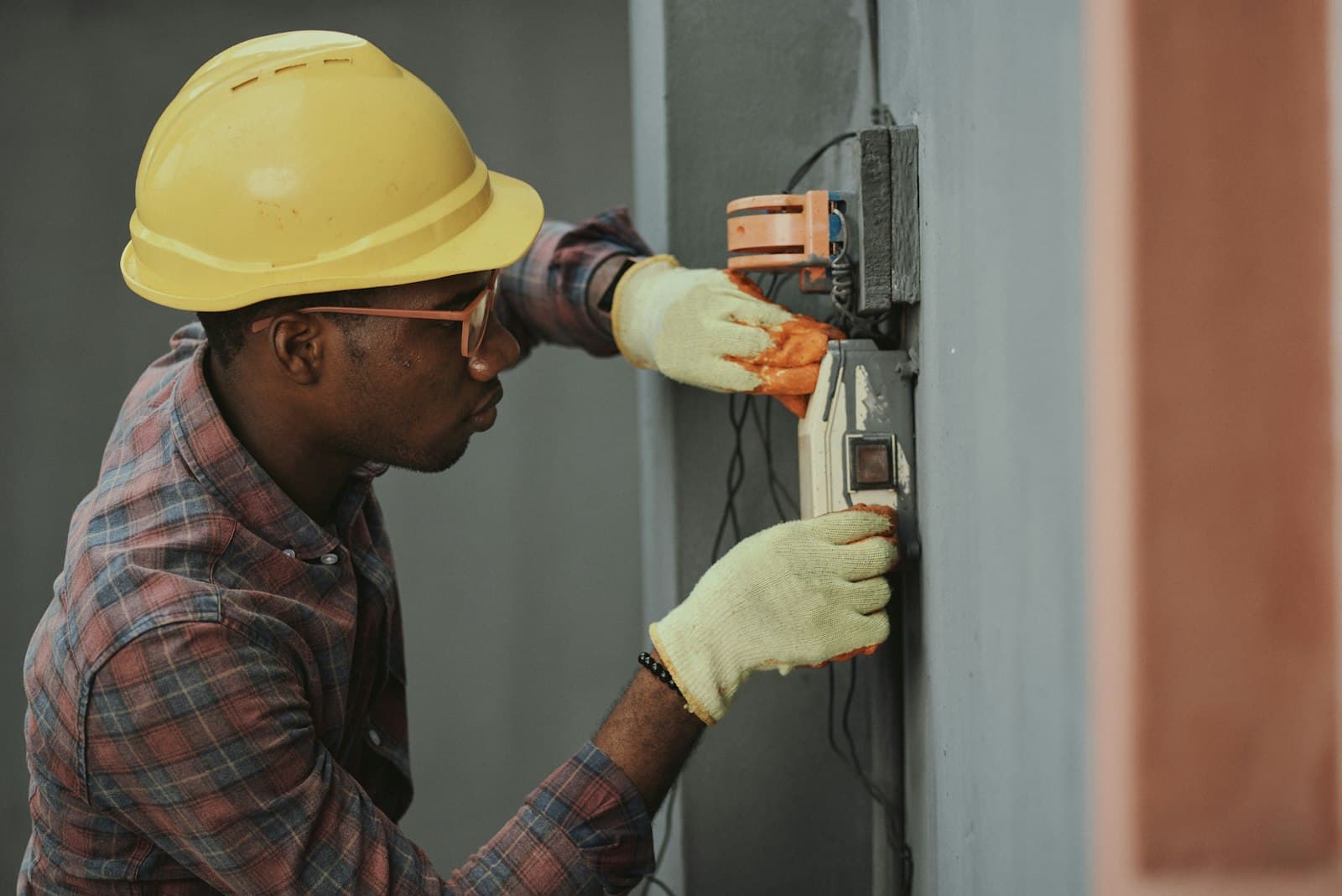 Licensed electrician working on a residential distribution board